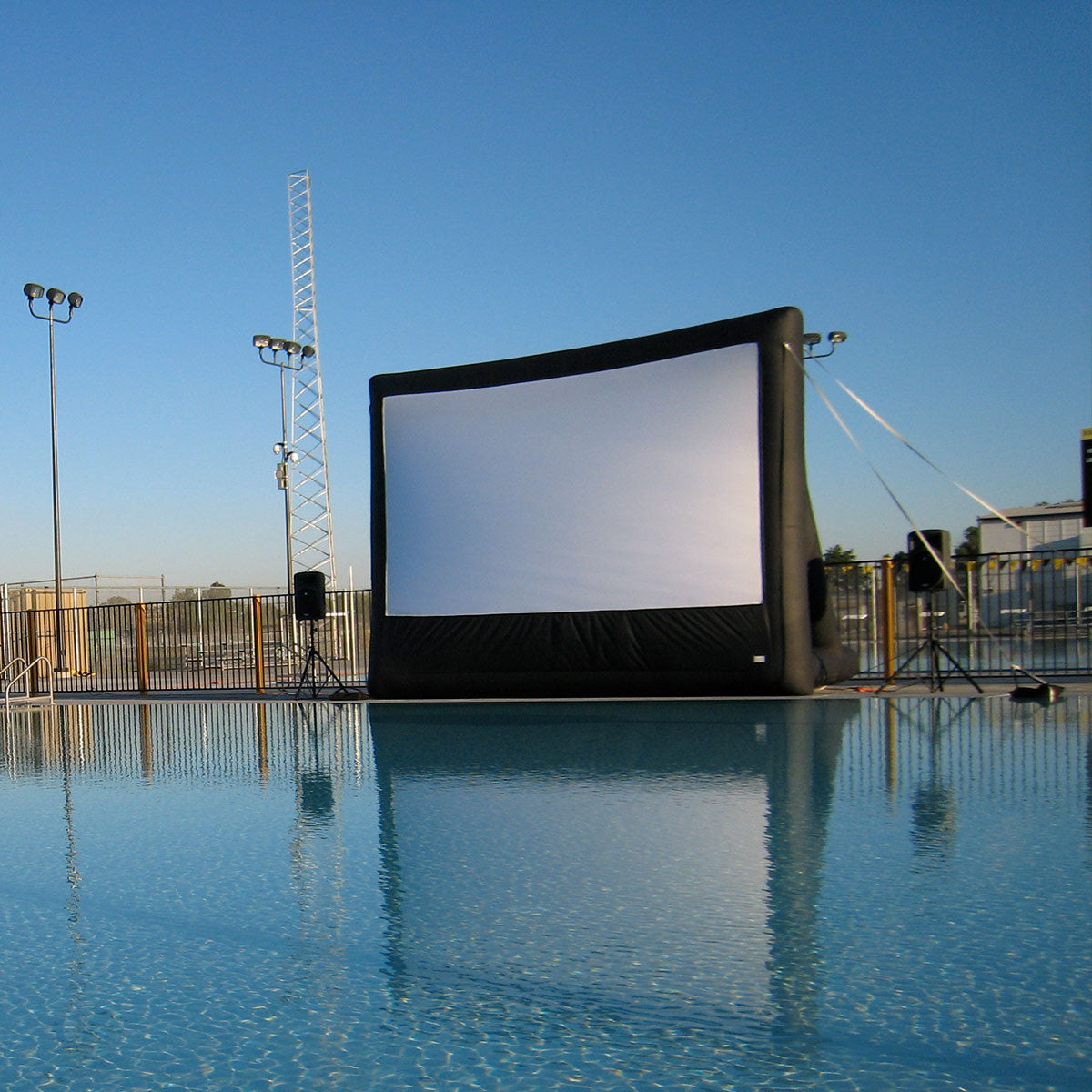 Open Air Cinema Pro 16' inflatable screen set up poolside
