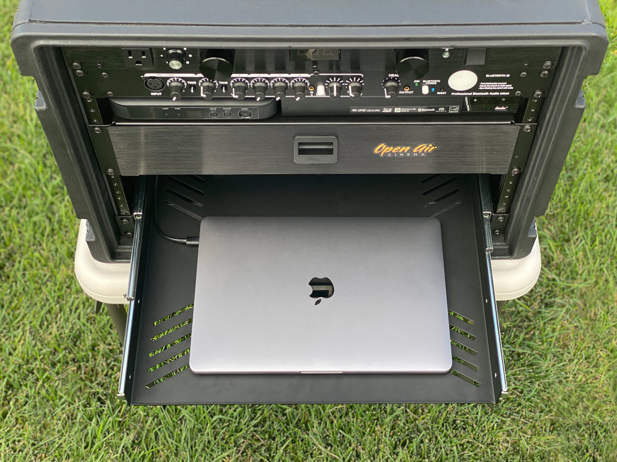CineBox Pro media console with MacBook laptop
