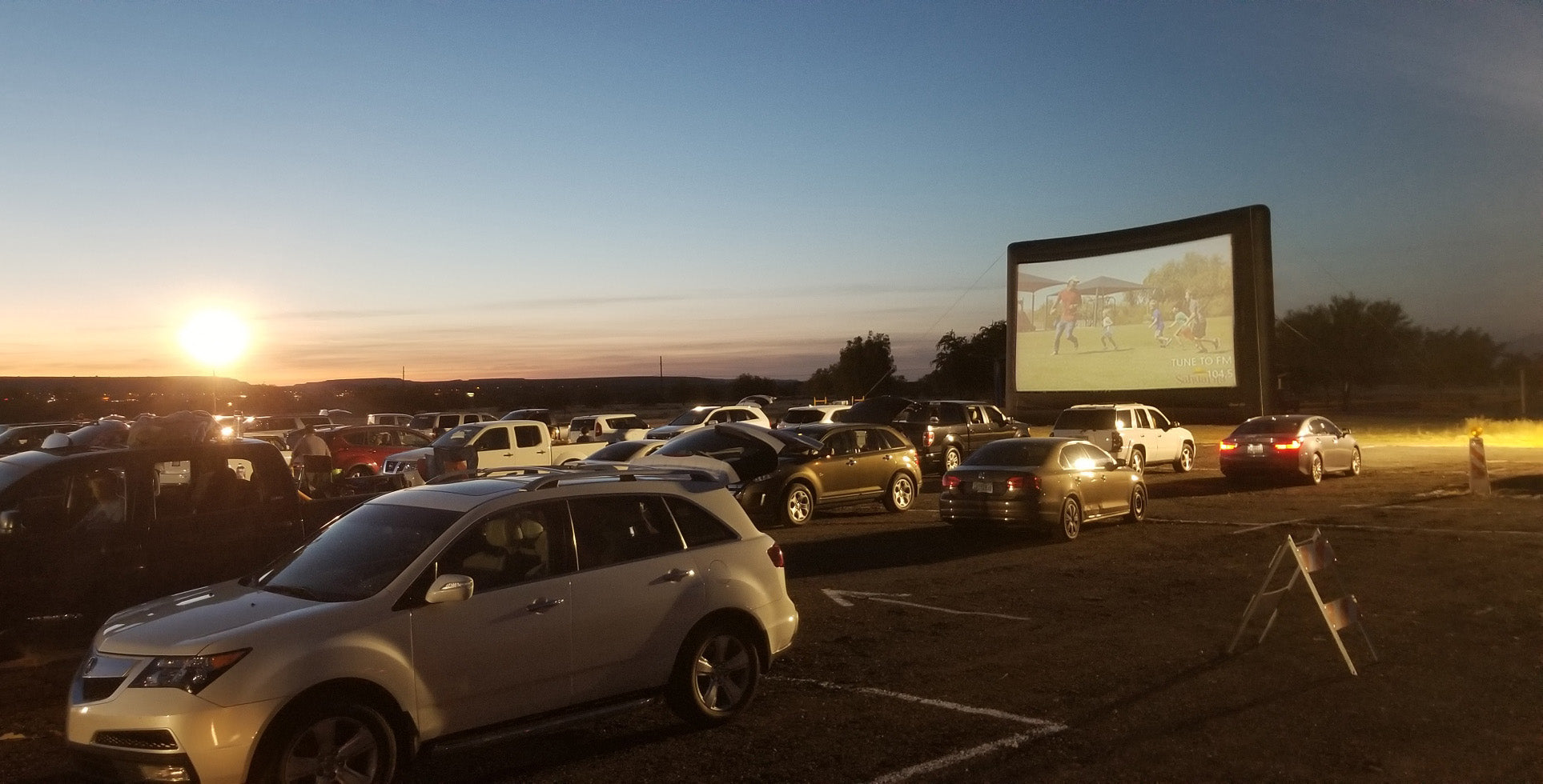 Open Air Cinema Elite 40' screen at a drive-in movie event in Tucson